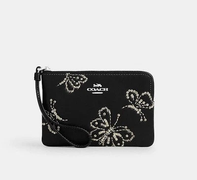 Muñequera Coach Corner con cremallera con estampado de mariposa brillante CCJ72 Foto 1 de 4