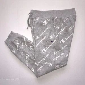 Pantalones deportivos CHAMPION para jóvenes y niños grises grandes con bolsillos estampados elásticos - Imagen 1 de 12