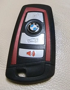 Usado OEM BMW Smart Key Fob Transmisor Remoto Serie 3 5 7 Borde Rojo YG0HUF5767 - Imagen 1 de 3