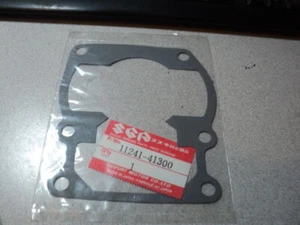 1975-81 SUZUKI RM TS 100 125 BASE GASKET NOS OEM P/N 11241-41300 11241-41310 - Picture 1 of 1