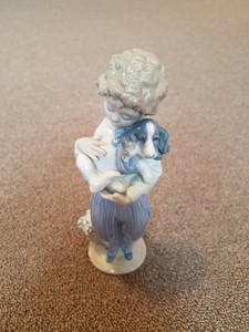 lladro boy sitting with dog