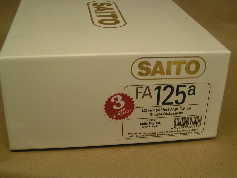 NEW SAITO FA-125 4-stroke engine, muffler, orig. box, papers, tools etc; - Image 1 of 3