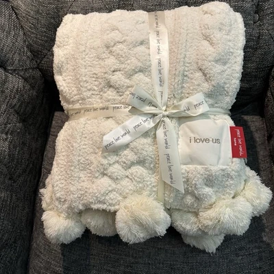 Nueva Manta Tejida Suave Cómoda Peace Love World 70x60 Blanco Crema Pom Cable Foto 1 de 4