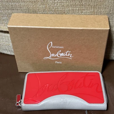 Christian Louboutin Cartera Larga Cremallera Redonda Roja x Blanca x Cuero Negro Foto 1 de 4