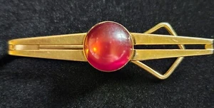 Mid Century Goldtone & Red Moon Glow Cabochon Tie Clasp by SWANK Vintage Lucite - Picture 1 of 6