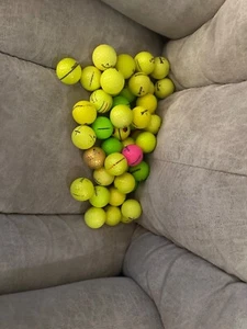 45 yellow mix golf balls. These are playable in very good condition. - Picture 1 of 2