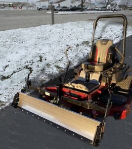 Swinging Tool Bar and Snow Blade Ezra Lawn Care Equipment mounts on a zero turn