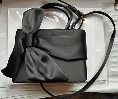 Mini bolso de mano con detalle de lazo de mango en oro negro Foto 1 de 4