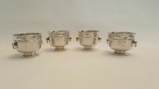 Edwardian set of four Arts & Crafts salt cellars in the manner of wine coolers.