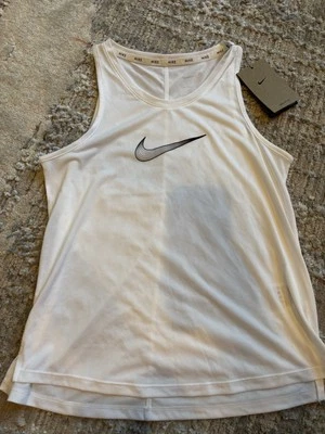 Camiseta sin mangas juvenil Nike Dri Fit talla grande blanca con swoosh negro Foto 1 de 3