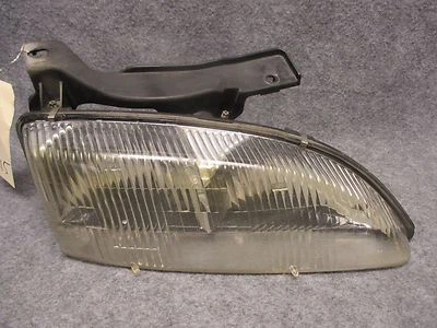Faro delantero derecho Chevy Cavalier 1995-1999 con panel de montaje OEM I653 Foto 1 de 3