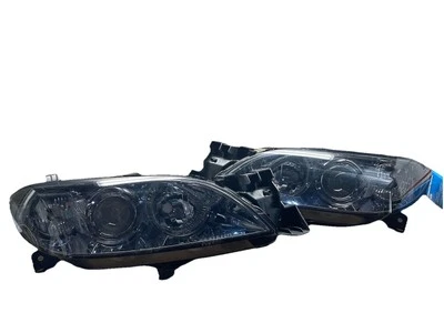 Faro halógeno ahumado cromado #P20 adecuado para Mazda 3 sedán/4 puertas Foto 1 de 4