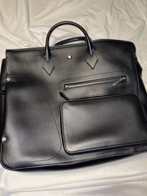 Bolso de cuero MontBlanc 24/7 para mujer negro y Tory Burch Foto 1 de 4