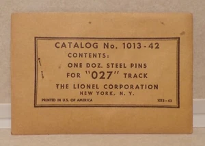 Lionel Postwar Twelve (12) Steel Pins O27 Gauge Track in SEALED 1013-43 Envelope - Picture 1 of 2