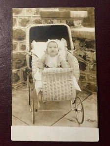 Grinning Baby in Wicker Carriage Real Photo Postcard RPPC - Picture 1 of 3