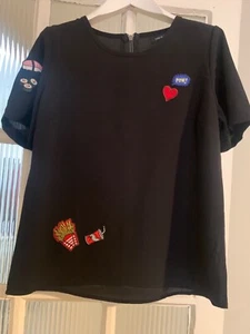 Ladies New Look black short sleeved top with fun logos, size S - Picture 1 of 7