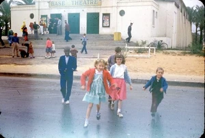 Vintage 35mm Slide CHILDREN LEAVING BASE THEATRE WHEELUS AIR BASE TRIPOLI 1952 1 - Picture 1 of 3