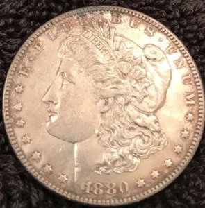 morgan 1880 silver dollar with a Bullseye Ring About Uncirculated Condition. - Picture 1 of 2