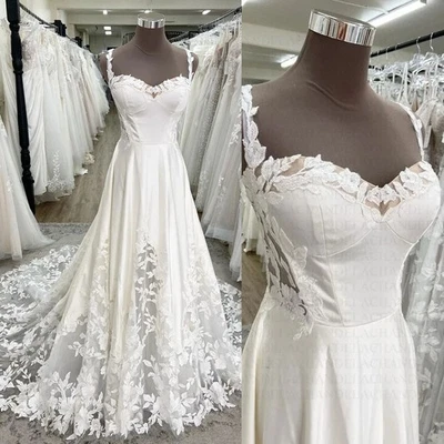 Vestido de novia clásico línea A novia sin mangas apliques en la espalda abierta Foto 1 de 4