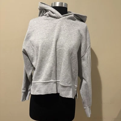 Acogedora sudadera Top Zara gris manga larga recortada con capucha talla L Foto 1 de 4