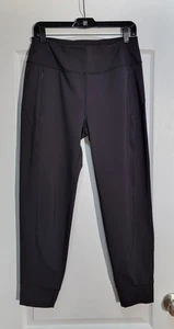 Athleta Rainier Jogginghose Damen Medium schwarz Mid Rise Reißverschlusstaschen Trainingshose - Bild 1 von 7