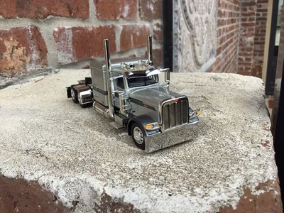 1/64 DCP PETERBILT 389 W/ 63" FLAT TOP SLEEPER. Silver/GunMetal. - Image 1 of 4