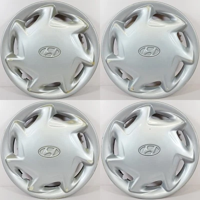 Tapacubos/cubiertas de rueda originales Hyundai Sonata # 55529 14" 7 radios JUEGO USADO/4 Foto 1 de 4