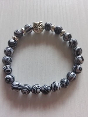 Bracciale di perline con gufo - Immagine 1 di 4