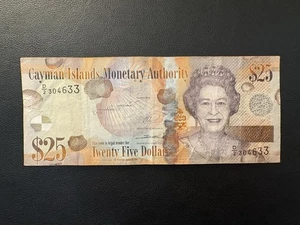 Billete de 25 dólares 2014 de las Islas Caimán Reina Isabel II QE2 - Imagen 1 de 3