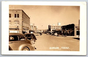 Ranger~Arcadia Theatre (Razed Like Other Bldgs)~Chrysler-Plymout Car Dealer~RPPC - Picture 1 of 2