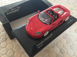 PORSCHE CARRERA GT PROTECTORES ROJO MODELO 1:43 MINICHAMPS EDICIÓN LIMITADA NUEVO 2003 - Imagen 1 de 11
