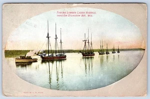 1909 TOWING LUMBER LADEN VESSELS through STURGEON BAY WISCONSIN POSTCARD - Picture 1 of 2
