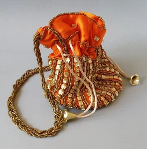 Borsa rotonda con perline arancioni. Alto 6,5". Cinturino con perline tono oro - Foto 1 di 7