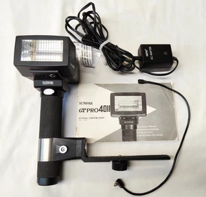 Flash para cámara Sunpak GT PRO 4011 con adaptador de CA y manual original -funciona -AF - Imagen 1 de 10