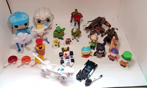 Assortment of 23 Figures including South Park, Ren & Stimpy, M&M, Tron, Mario Cover