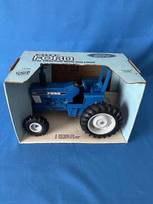 Tractor 1/16 Ertl Ford 7710 con barra antivuelco #836 asistencia de tracción delantera orientable Foto 1 de 4