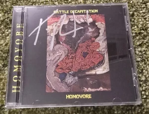 Cattle Decapitation - HOMOVORE Remastered CD 2021 Three One G AUTOGRAPHED SIGNED - Foto 1 di 5