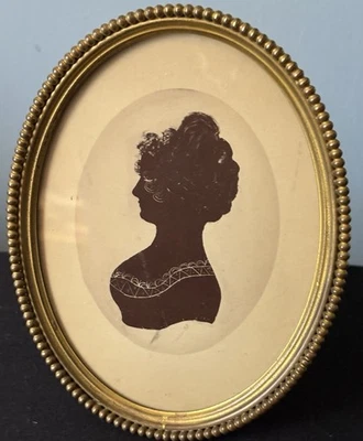 Vintage Brass Oval Free Standing Brass Picture Frame Printed Silhouette 5 5/8 - Image 1 of 4