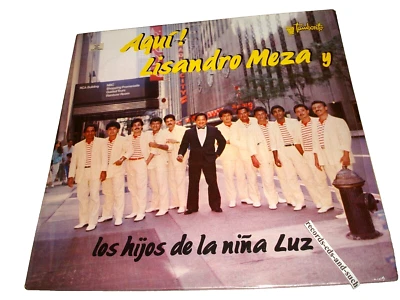 Lisandro Meza Y Los Hijos De La Nina Luz-Aqui!- 03(0131)00105 NM/VG+ VINYL LP - Image 1 of 3