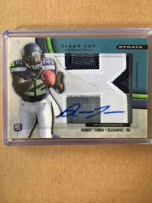 2012 Topps Strata Robert Turbin Clear Cut RC Patch Auto #62/75 - Image 1 of 2