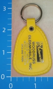 Vintage MR. GOODWRENCH WOODRUSS OLDSMOBILE DETROIT Autohändler Schlüsselanhänger   - Bild 1 von 2