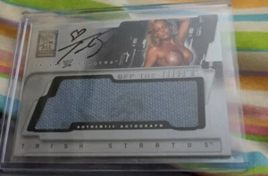 WWF WWE TRISH STRATUS 2002 FLEER AUTOGRAPHED OFF THE MAT RELIC WITH BLOOD STAINS - Picture 1 of 3