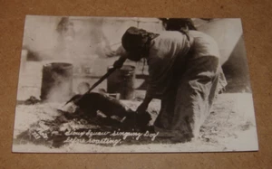 c1935 Sioux Indian Preparing Dog For Roasting RPPC South Dakota Bell Photo 733 - Picture 1 of 3