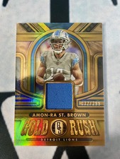 Amon-Ra St. Brown 2023 Panini Gold Standard Football Gold Rush Jersey 32/299