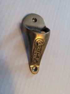 Abridor de botellas vintage de latón de Coca Cola montado en la pared - Imagen 1 de 12