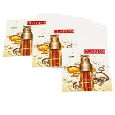 Tarjeta de 3 muestras Clarins doble suero sistema hidráulico + lipídico cúrcuma cúrcuma 0,03 oz Foto 1 de 3