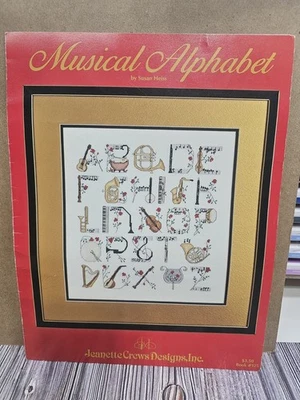 JEANETTE CREWS DESIGNS MUSICAL ALPHABET Cross Stitch Pattern INSTRUMENTS GUITAR - Image 1 of 2