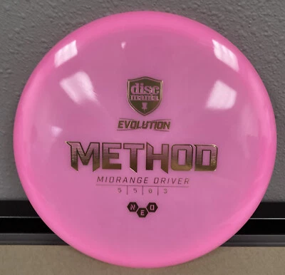 Discmania Evolution Neo Method Midrange Disc Golf 176g Pink with Gold Foil - Image 1 of 3