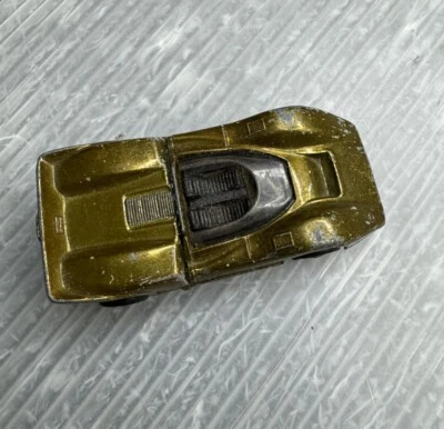 McLaren M6A 1969 dorado con interior negro Hot Wheels Redlines vintage Foto 1 de 4