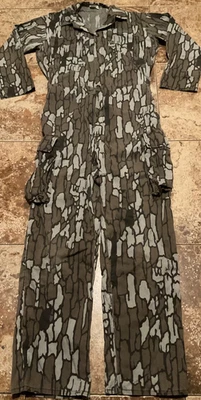 MACACÃO CAMUFLADO VINTAGE LONA CASCA DE ÁRVORE (TAMANHO ADULTO PEQUENO MASCULINO) HIMALAIA IND. - Imagem 1 de 4